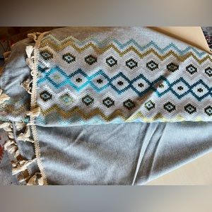 Round Grey/Blue Embroidered Table cloth with fringe.  Used one, washed.